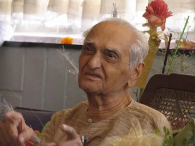 Ramesh welcoming visitors to his sea-facing apartment