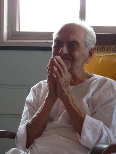 Ramesh seated peacefully in natural light